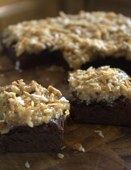 dark chocolate brownies with an ooey gooey coconut pecan icing